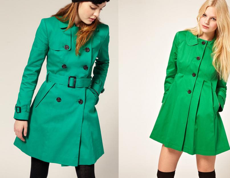معطف أخضر عصري.  معطف المطر الأخضر هو شيء مشرق في خزانة ملابس نسائية عصرية.
